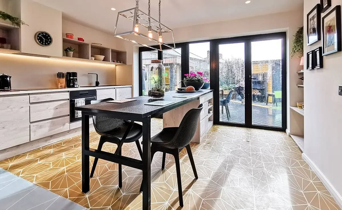 Visofold 1000 bifold doors opening from an accessible kitchen in Swindon Wiltshire