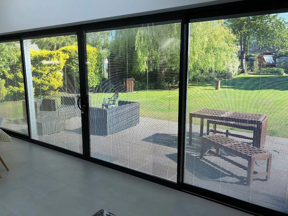 Integral blinds for sliding patio doors