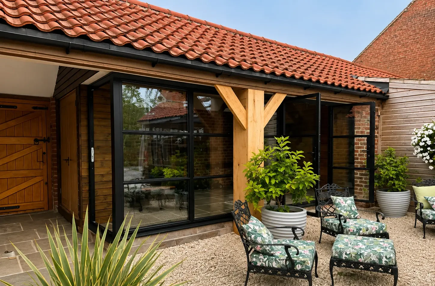 Barn gym conversion with heritage-style aluminium glazing at White House Farm, York